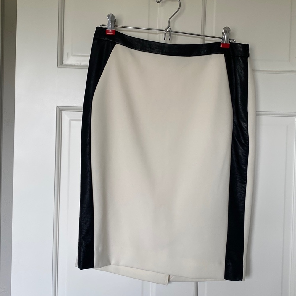 Winter white pencil skirt with vegan leather accents and back kick slit.